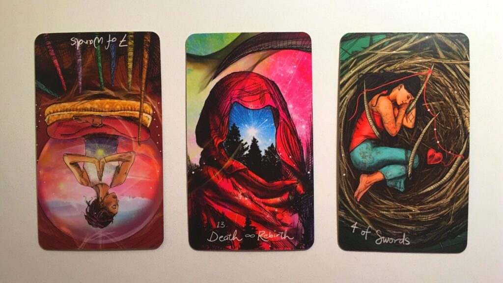 Seven of Wands, Reversed, the Death and Rebirth card, and Four of Swords from the Light Seer's Tarot deck