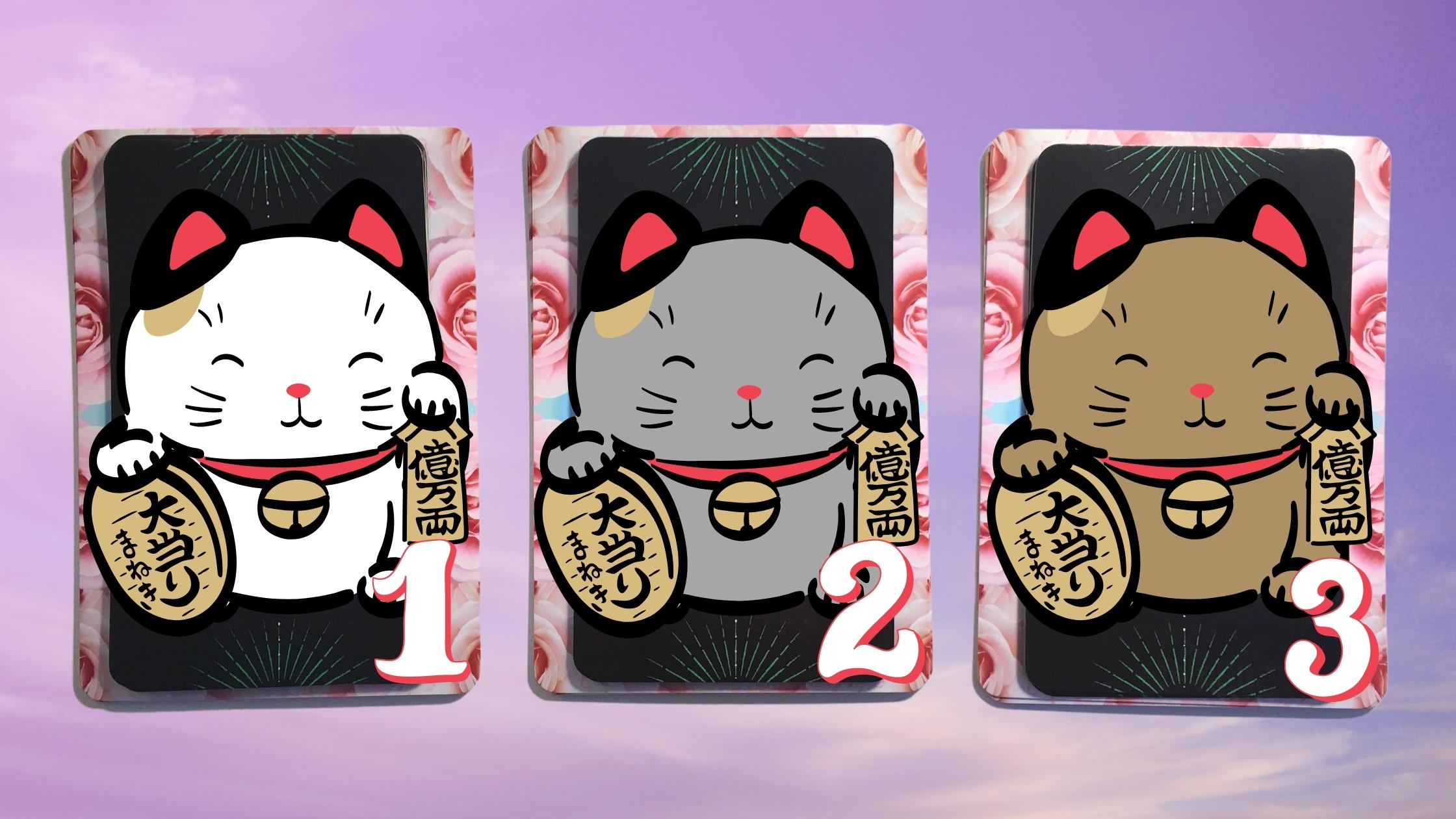 Three tarot and oracle pick a card piles with lucky cats on them