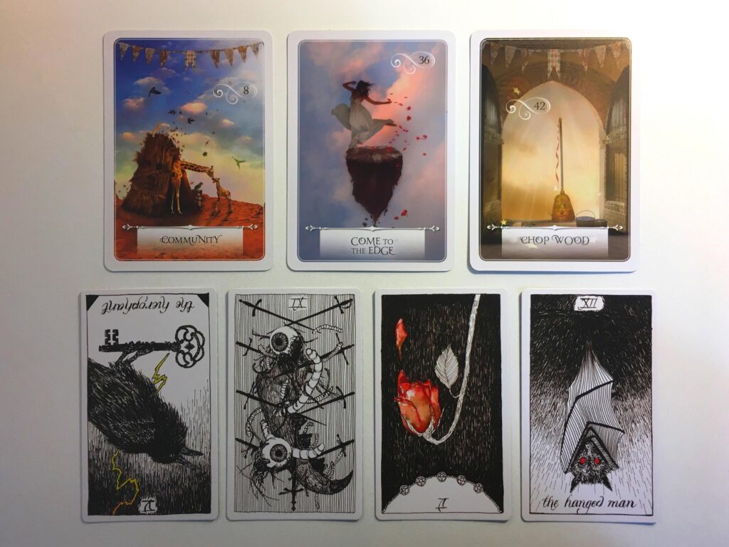 Three cards from the Wisdom of the Oracle deck and four cards from the Wild Unknown Tarot deck