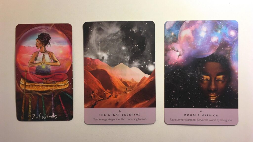 Card from the Light Seer's Tarot and two cards from the Starseed Oracle decks