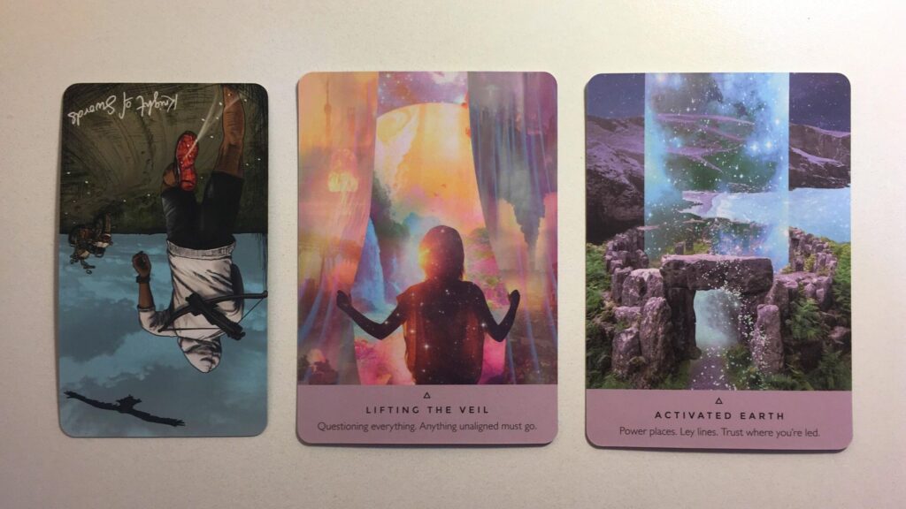 Card from the Light Seer's tarot and two cards from the Starseed Oracle decks