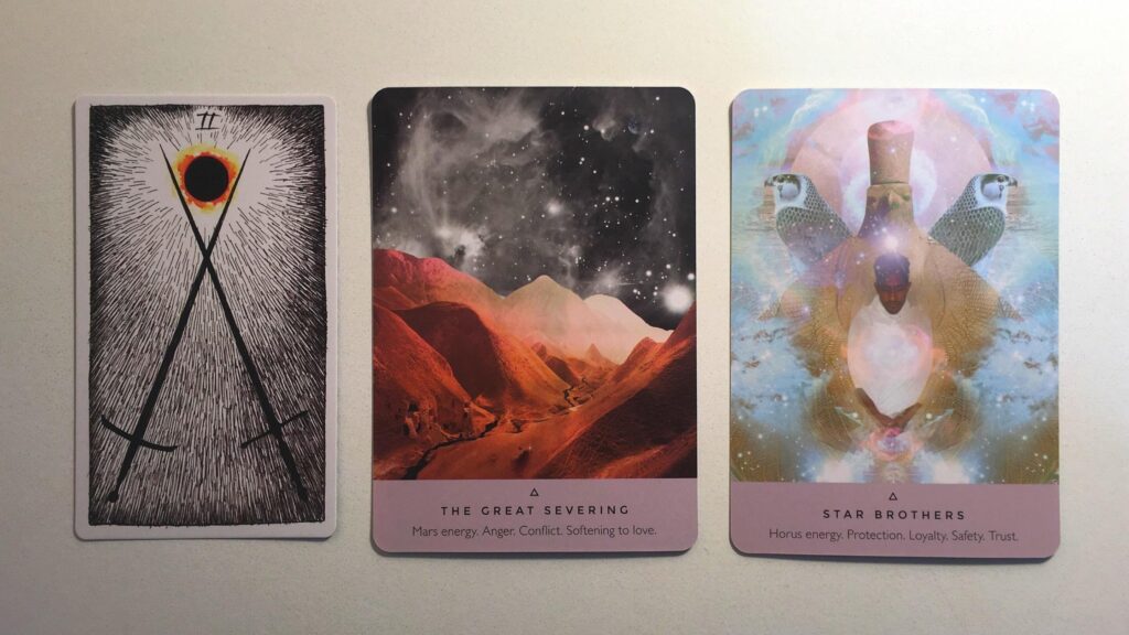 Card from the Wild Unknown Tarot deck and two cards from the Starseed Oracle deck