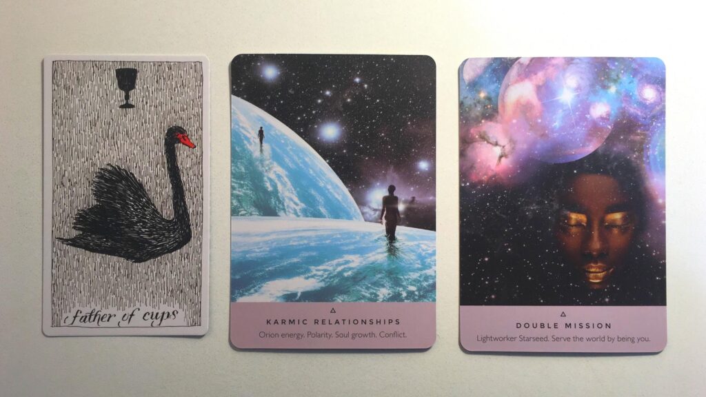 Card from the Wild Unknown Tarot deck and two cards from the Starseed Oracle deck