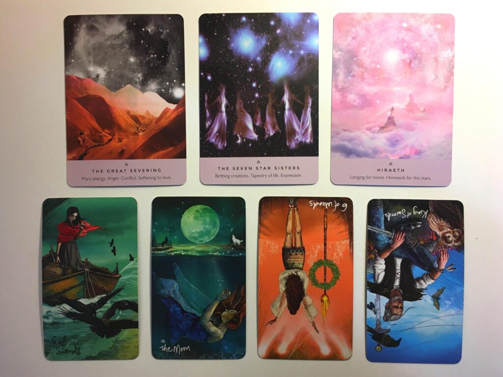 Three cards from the Starseed Oracle and four cards from the Light Seer's Tarot decks