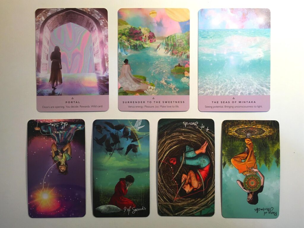 Three cards from the Starseed Oracle and four cards from the Light Seer's Tarot deck