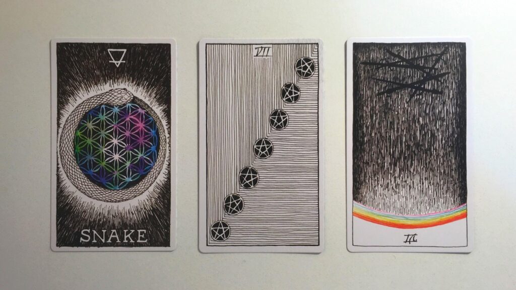 Card from the Animal Spirit Oracle and two cards from the Wild Unknown Tarot decks