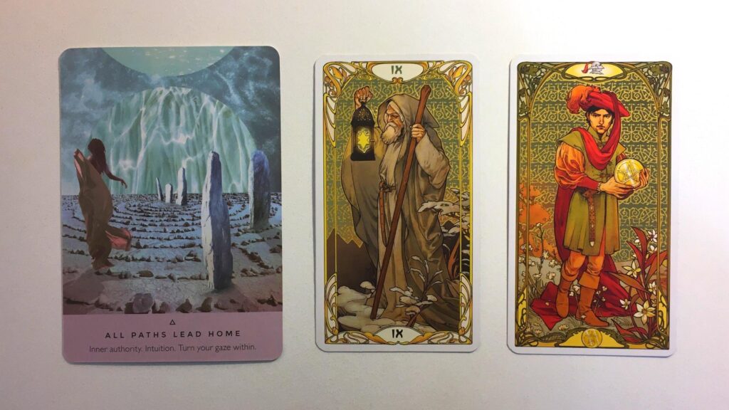 Card from the Starseed Oracle and two cards from the Golden Art Nouveau Tarot deck