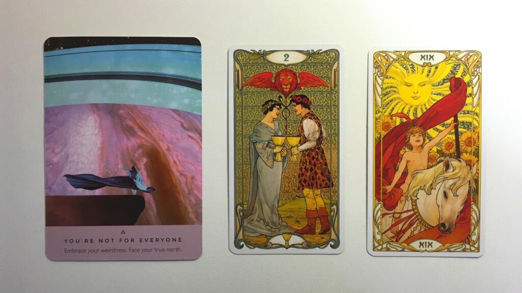 Card from the Starseed Oracle and two cards from the Golden Art Nouveau Tarot decks