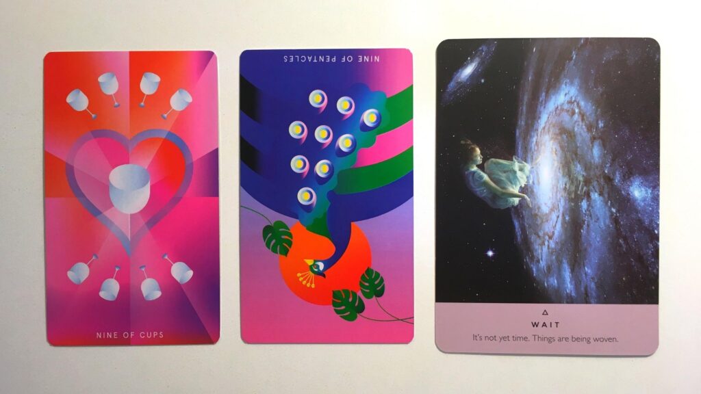 Two cards from the Mystic Mondays Tarot and a card from the Starseed Oracle Deck