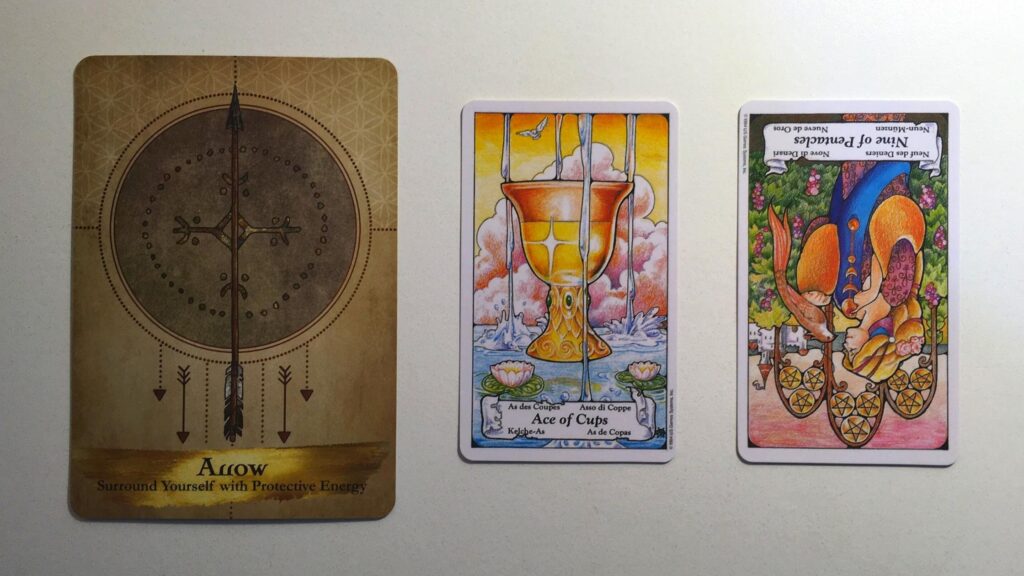 Card from the Angels and Ancestors Oracle and two cards from the Hanson-Roberts Tarot decks