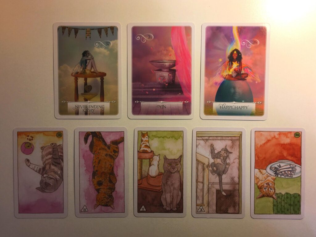 Cards from the Wisdom of the Oracle and Cat Tarot decks