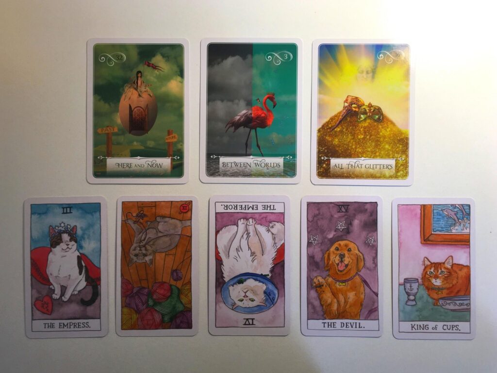 Cards from the Wisdom of the Oracle and Cat Tarot decks