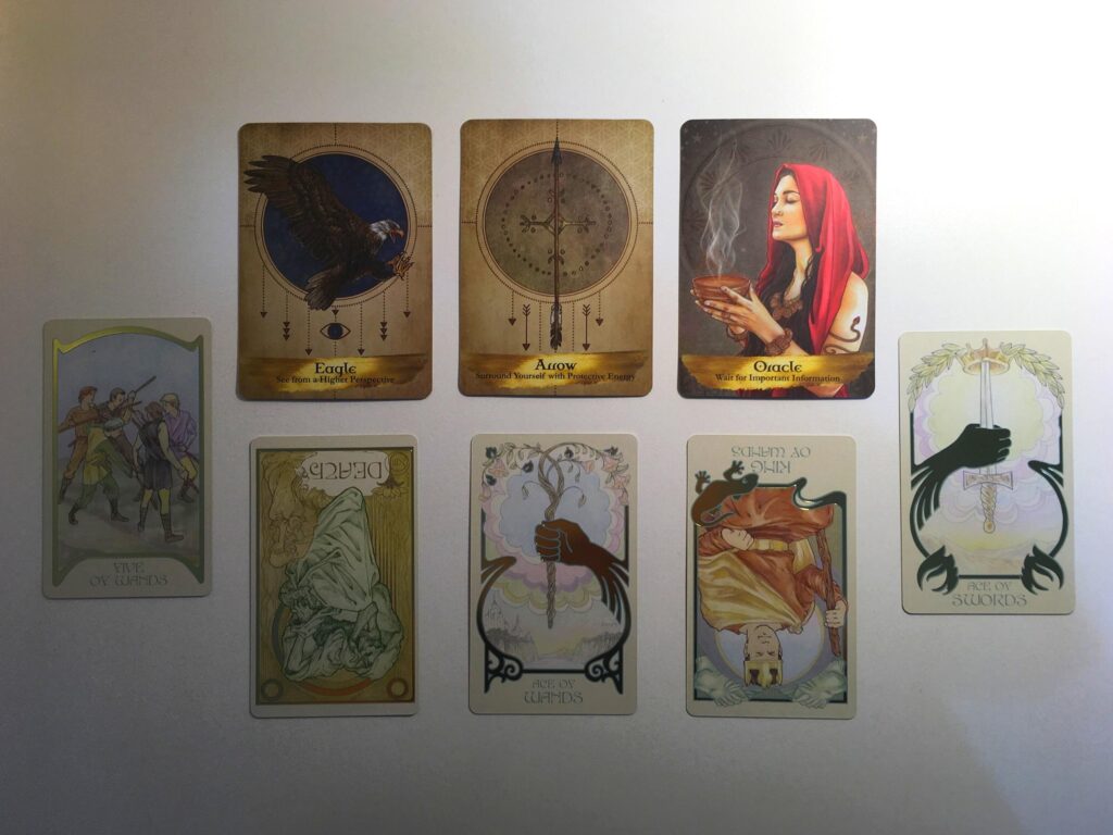 Cards from the Ethereal Visions Illuminated Tarot and Angels and Ancestors Oracle decks