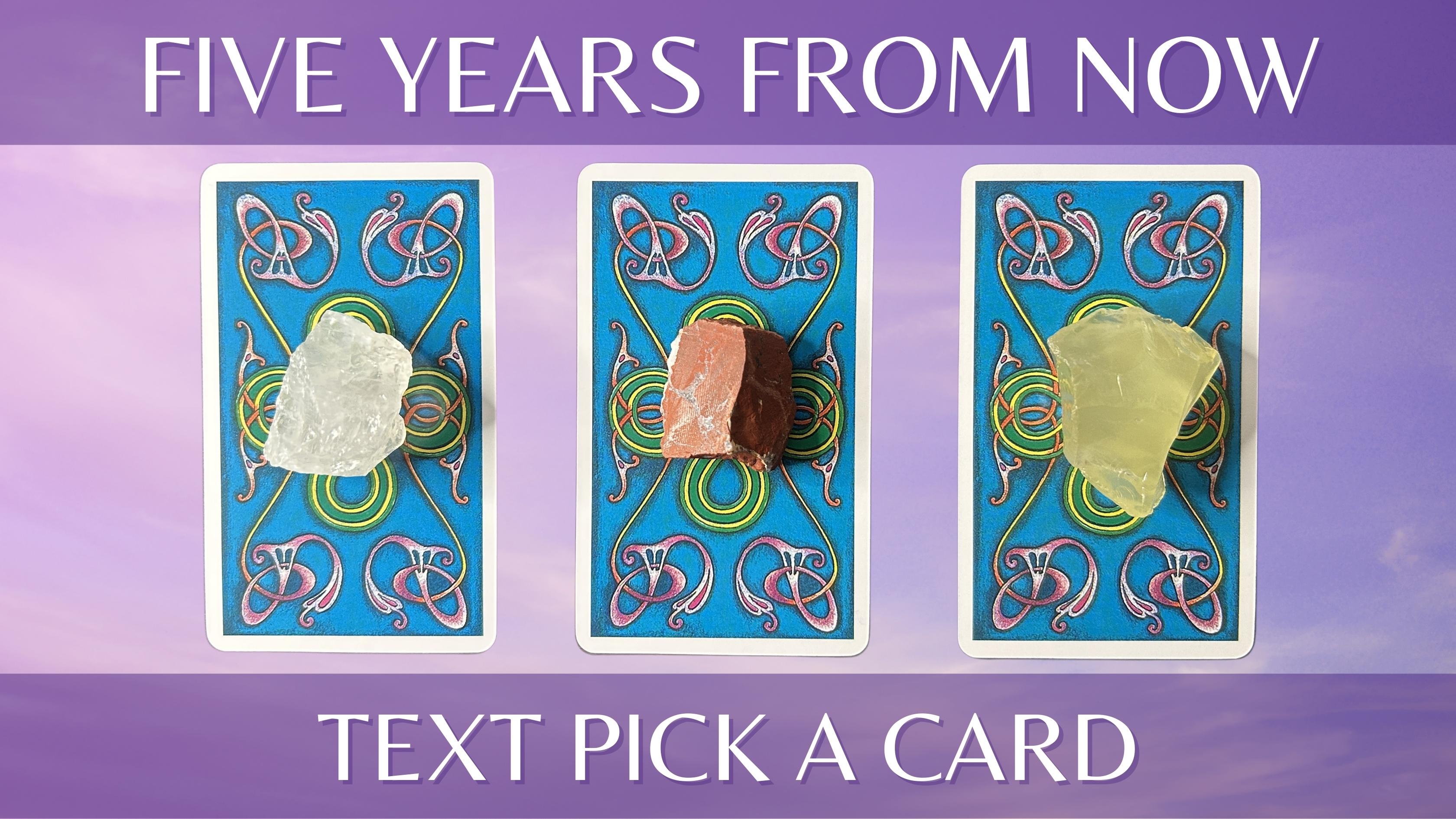 Three tarot card piles with crystals on them