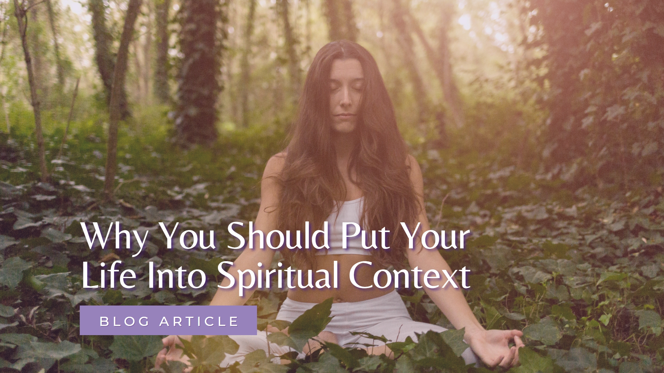 A woman meditating on the forest floor