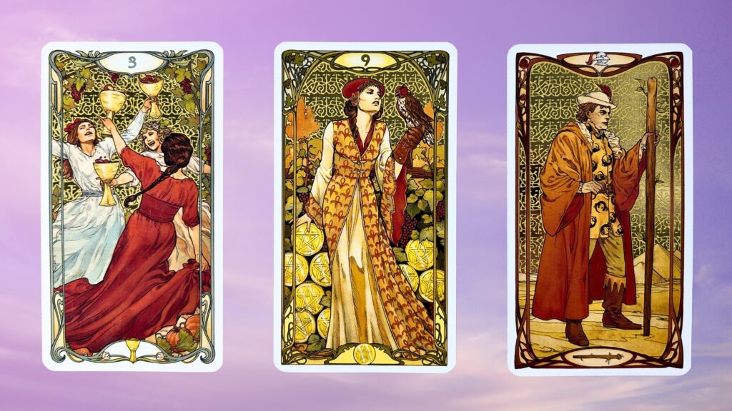 Cards from the Golden Art Nouveau Tarot deck: Three of Cups, Nine of Pentacles, and the Page of Wands