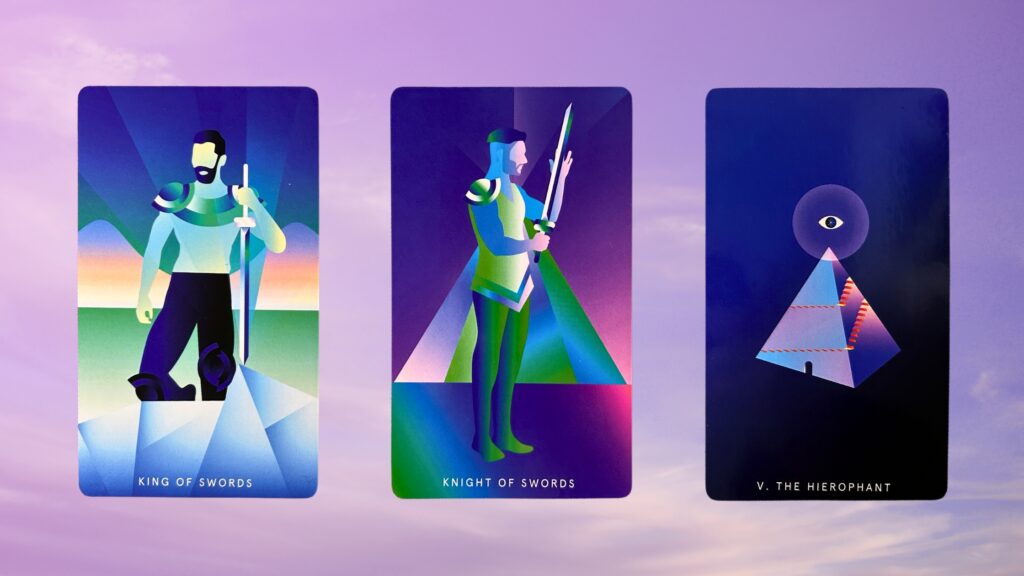 Cards from the Mystic Mondays Tarot deck: King of Swords, Knight of Swords, and The Hierophant