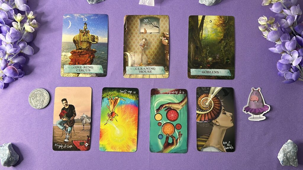 Cards from the Enchanted Map Oracle and the Light Seer's Tarot decks