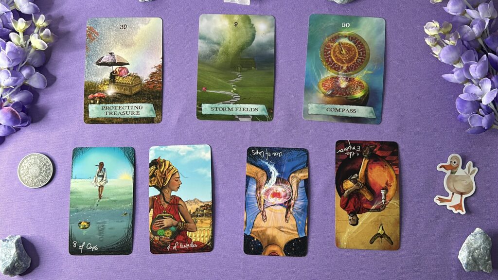 Cards from the Enchanted Map Oracle and the Light Seer's Tarot decks