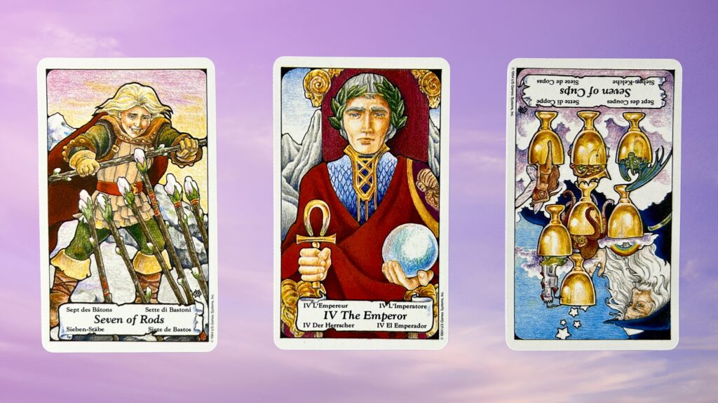 Cards from the Mary-Hanson Roberts Tarot deck: seven of rods, the emperor, and the seven of cups