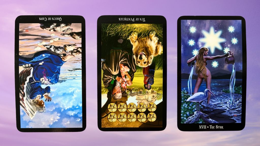 Cards from the Witches Tarot: Queen of Cups, Ten of Pentacles, and The Star