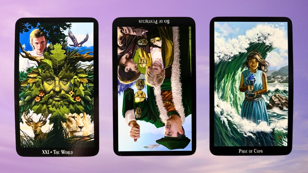 Cards from the Witches Tarot deck: The World, Six of Pentacles, and Page of Cups