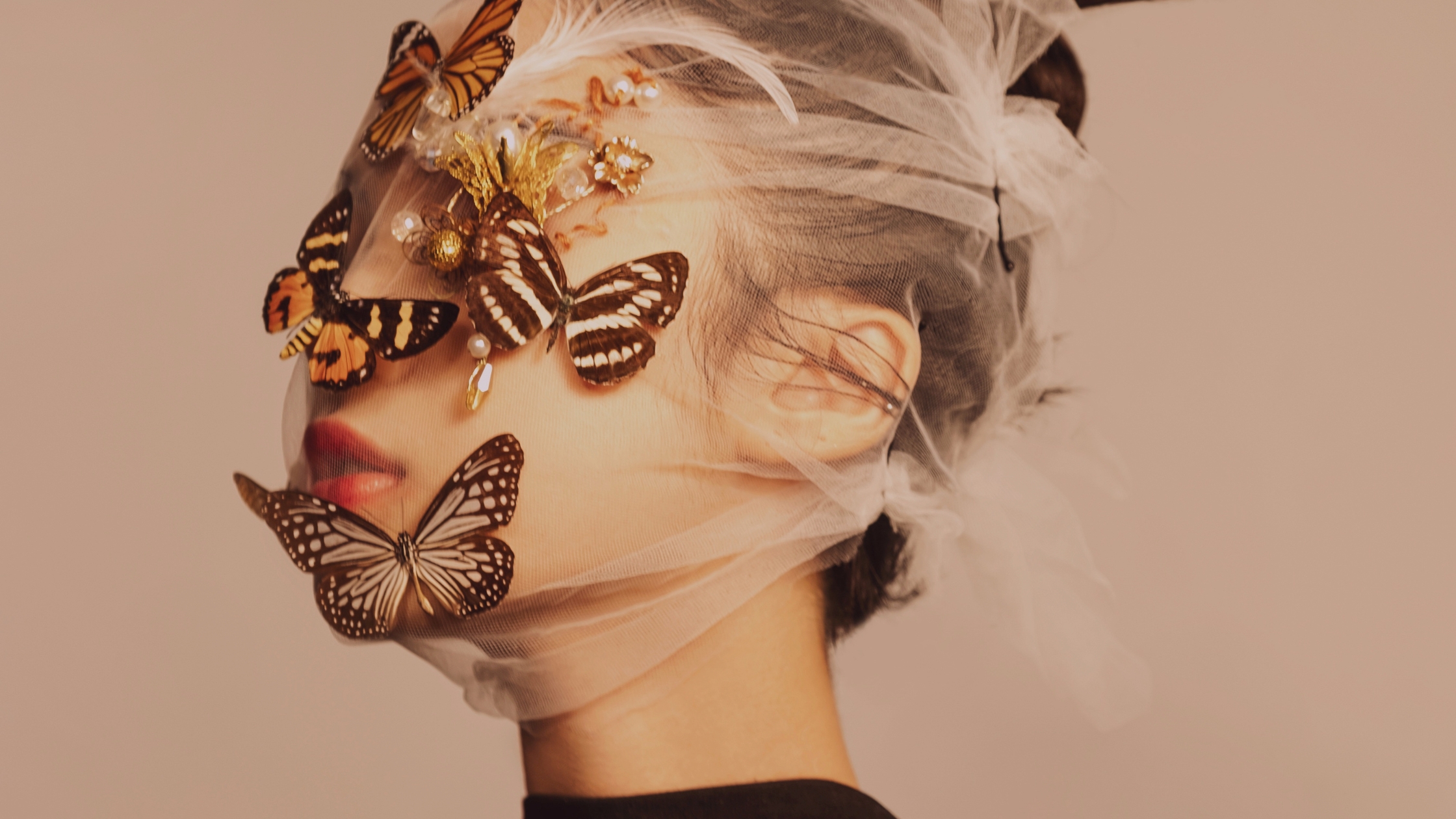 Woman with butterflies on her face