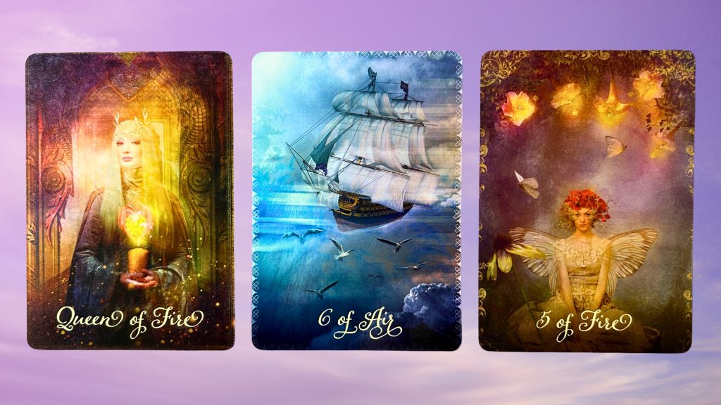 Cards from the Good Tarot deck: Queen of Fire, Six of Air, and Five of Fire
