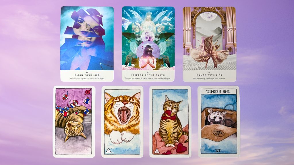 Cards from the Work Your Light Oracle and the Cat Tarot decks