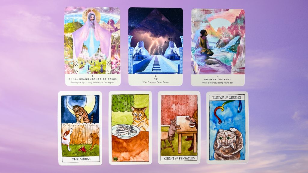 Cards from the Work Your Light Oracle and the Cat Tarot decks